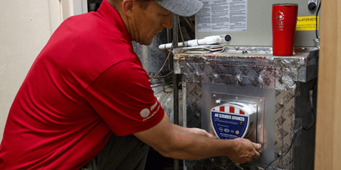 An A&amp;E HVAC tech installs a new Air Scrubber Advanced air scrubber to an existing ductwork system in a home.