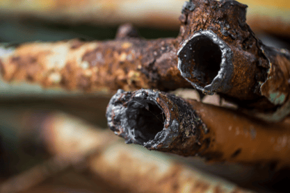 A shot of corroded pipes, showing how harmful certain cleaning products can be to residential pipes.