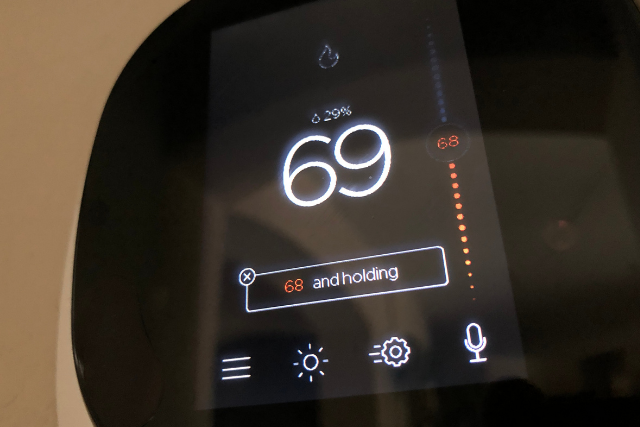 A close up of the ecobee Smart Thermostat, which reads 69 degrees Fahrenheit. 