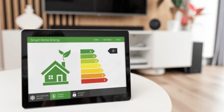 A tablet sits on a table, displaying how energy efficient the home is due to higher SEER2, EER, and HSPF2 ratings.