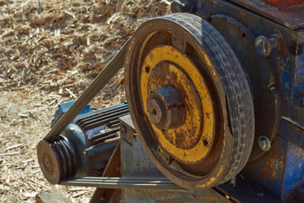 A close-up of a generator belt.