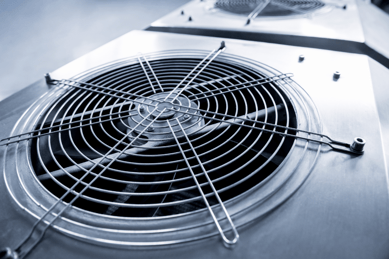 A close-up of a shiny metalic HVAC fan vent.