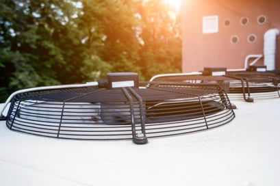 A closeup shot of an HVAC unit vent blowing during a hot day.