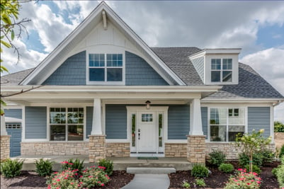 A shot of a blue and white painted home to show the importance of a home's layout for HVAC equipment