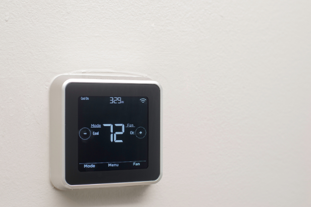 A wall-mounted Honeywell Smart Thermostat displaying that it is currently 72 degrees Fahrenheit. 