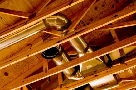 A shot from the perspective of a person looking into the ceiling of their home, their ductwork visible.